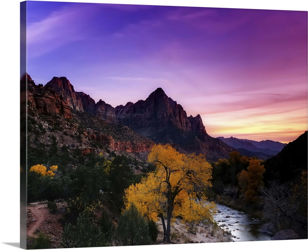 Wide angle view of sunset in Zion National Park in Utah from the Zion Valley Bridge overlooking the Virgin River, the Watc...