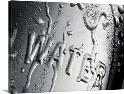 Water moulded in glass dripping with condensation