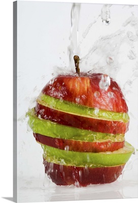Water pouring on apple