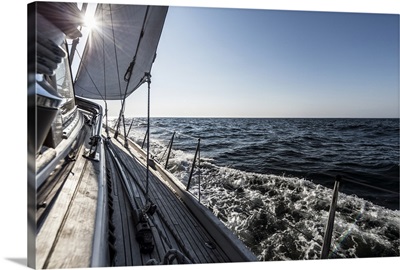 Water rushing by heeling 62 ft sailboat