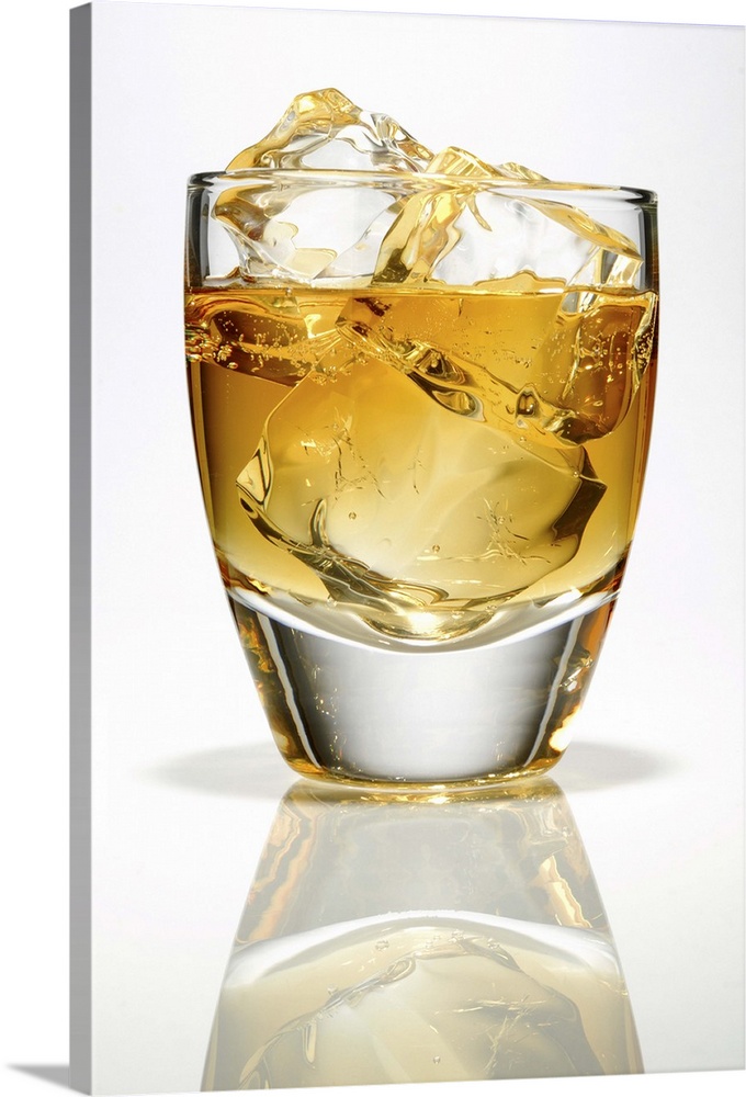 Bourbon whiskey with three ice cubes in a low ball glass.