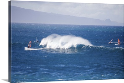 Windsurfers and giant waves