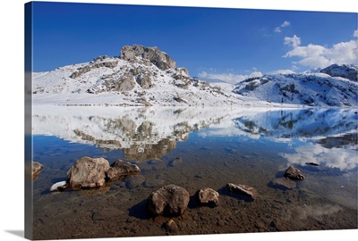 Winter view of lakes of Covadonga, reflection of mountain on lake.