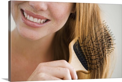 Woman combing her hair