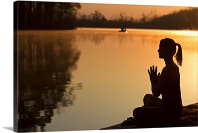 Woman does her yoga practice in nature