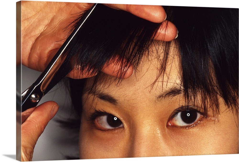 Woman having bangs cut