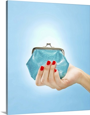 Woman holding change purse