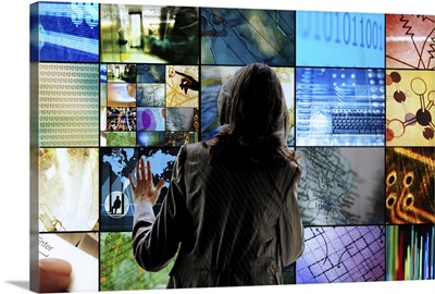 Woman interacting with multiple touch screens