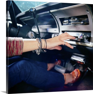 Woman Using Car Stereo
