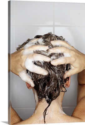 Woman washing her hair in shower