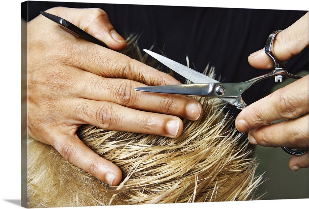 Woman's hands cutting hair