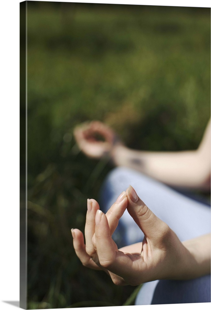 Woman's hands in yoga meditation position