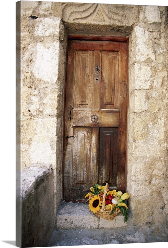 Wooden door and basket of flowers