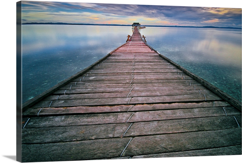 Wall art of a long pier leading out into the calm water.