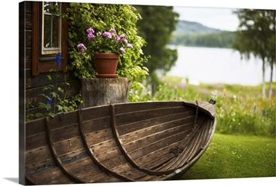Wooden rowboat in backyard
