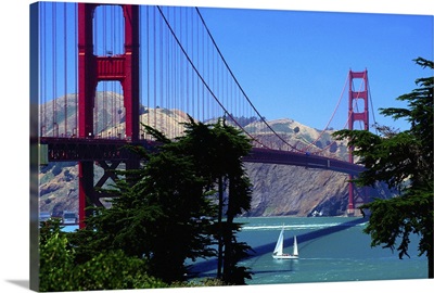 Yacht sailing under Golden Gate Bridge
