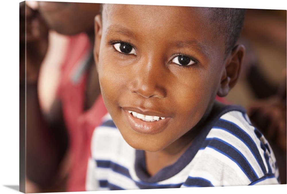 Portrait of a young 5-7 male in Haiti smiling