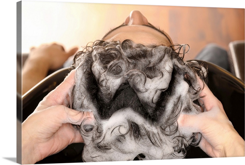 Foam on his head forming the letter 'w' for washing.