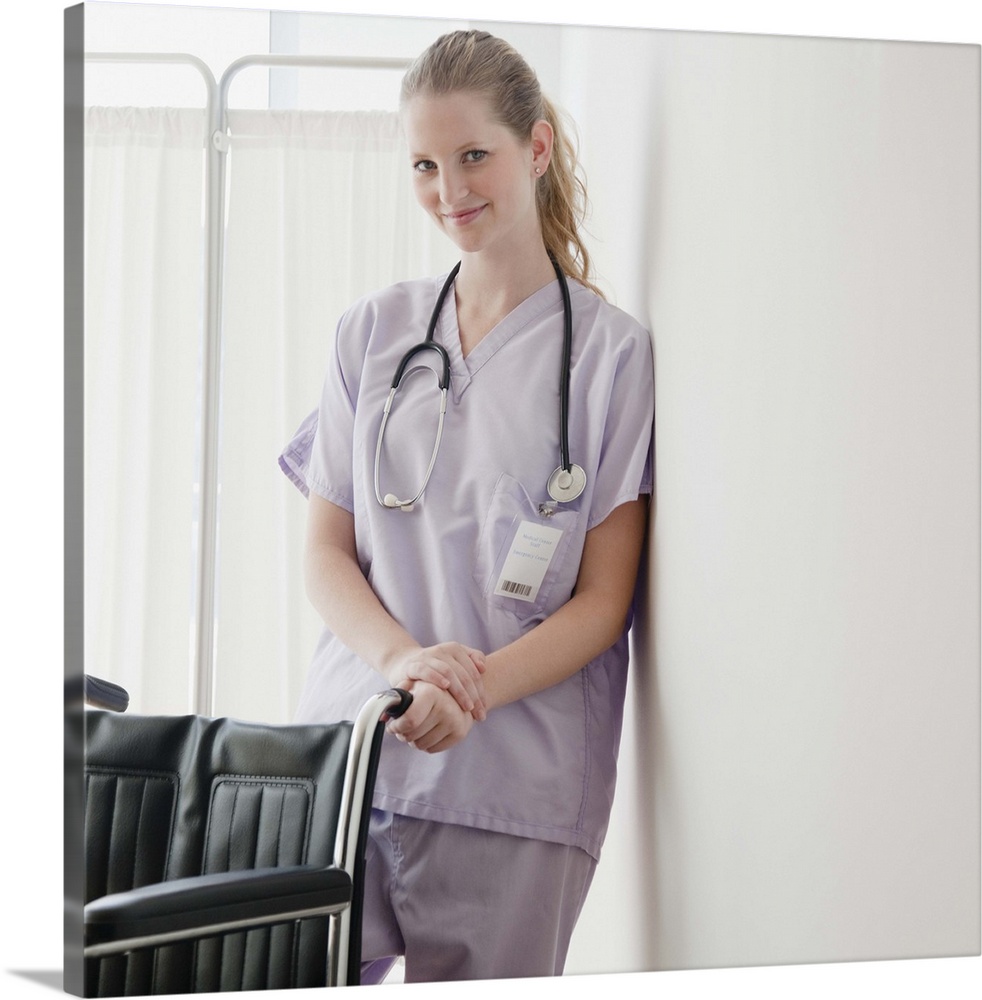 USA, New Jersey, Jersey City, Young nurse standing behind wheelchair