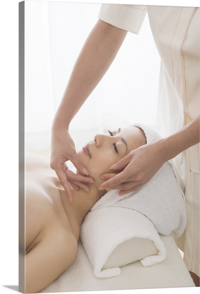 Young woman having facial massage