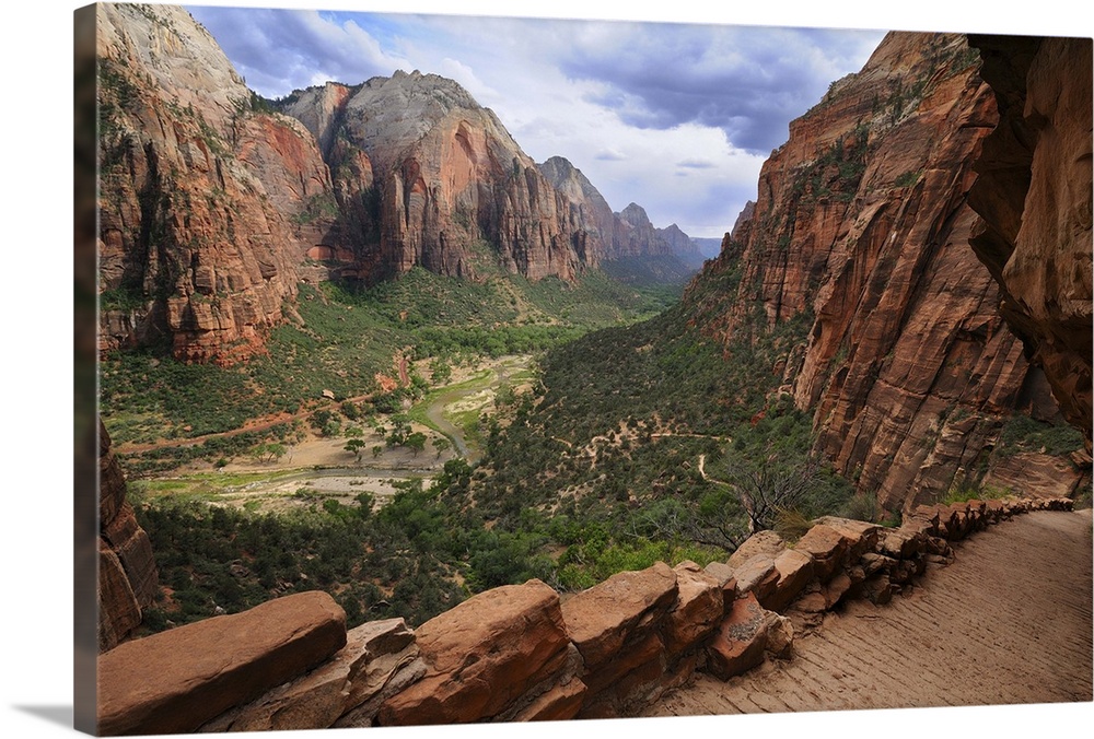 The Angel's Landing trail, a popular trail in Zion National Park, cuts into the side of the canyon as it winds towards a p...