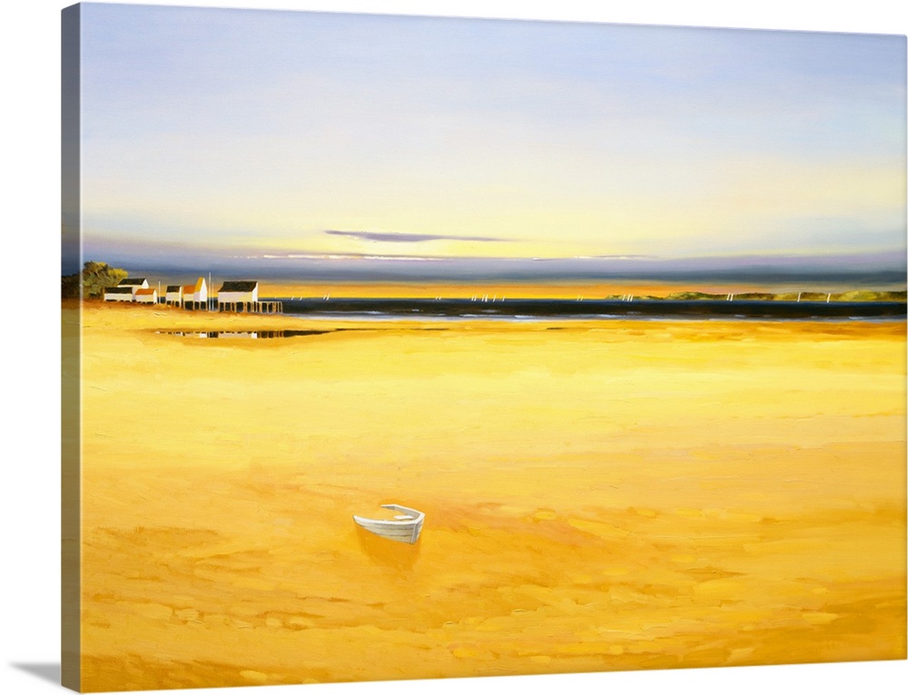 Seascape in the late afternoon with golden water and houses in the distance.
