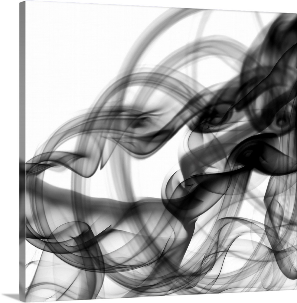 Wisps of black, billowing smoke photographed against a white background create a monotone abstract image.