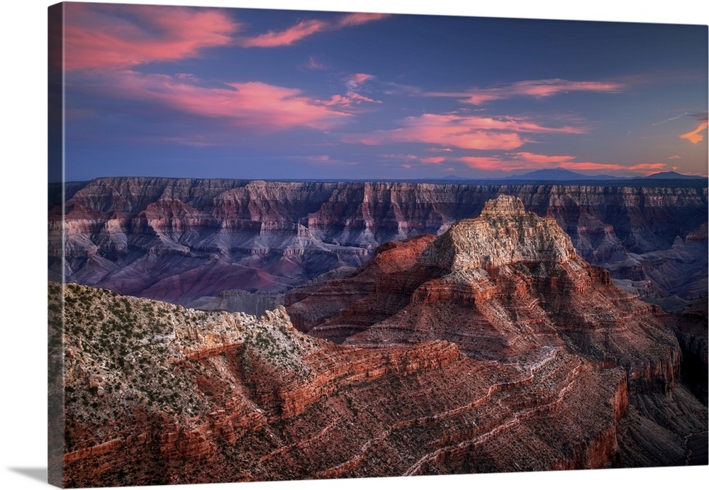 Sunset at Cape Royal Point on the Grand Canyon's North Rim can be stunningly beautiful, with clouds painted pastel colors....