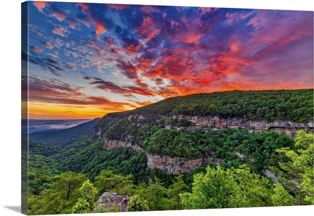 The rising sun lights up clouds over Sand Mountain at Cloudland Canyon State Park. Nearby Trenton, Georgia, is tucked in t...