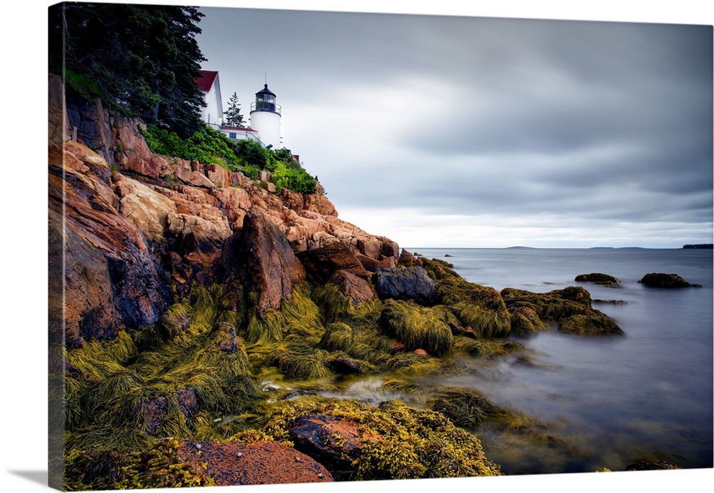 Maine's Bass Harbor Head Light overlooks the entrance to Bass Harbor, marking the rocky point to help mariners safely navi...