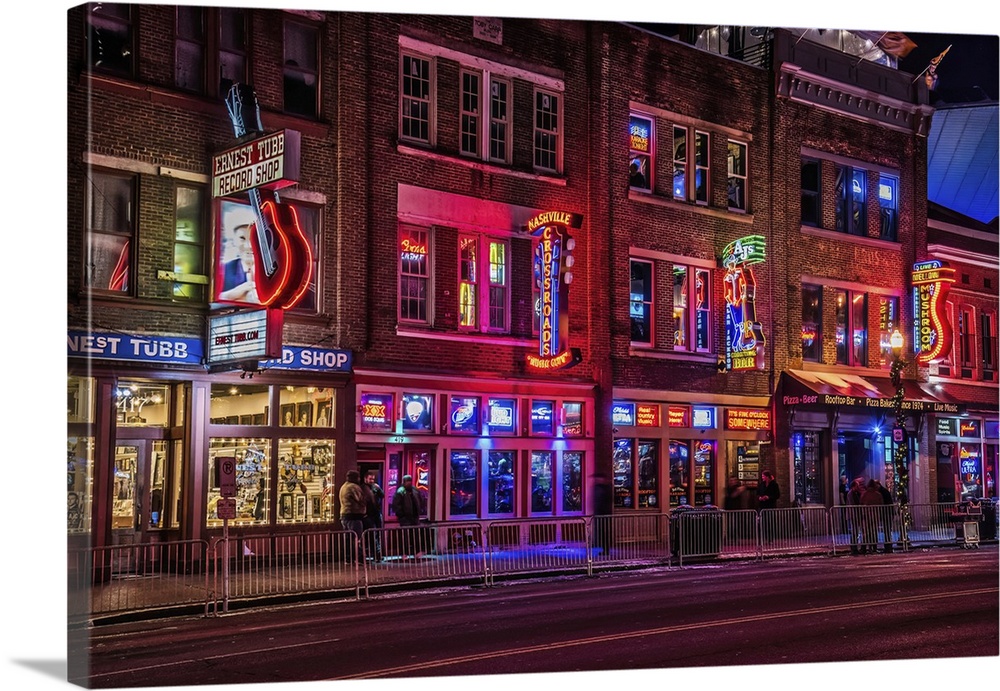 Broadway in downtown Nashville is lined with entertainment venues promoted with colorful neon signs. The Ernest Tube Recor...