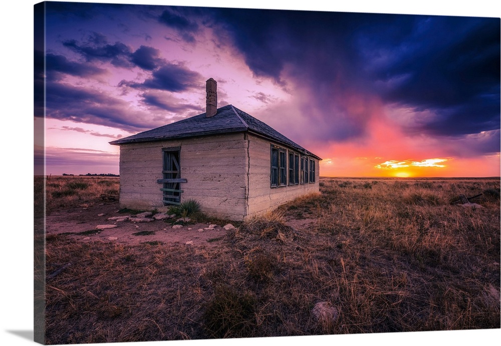 An amazing sunrise lights up an abandoned schoolhouse near Yuma, Colorado. The old school was built in 1890.
