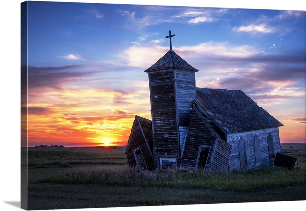 Another day ends with a brilliant sunset at the old St. Johns Lutheran Church in the ghost town of Arena, North Dakota.