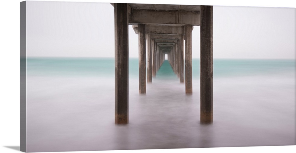 A contemporary painting of the bottom side of a pier at a beach.
