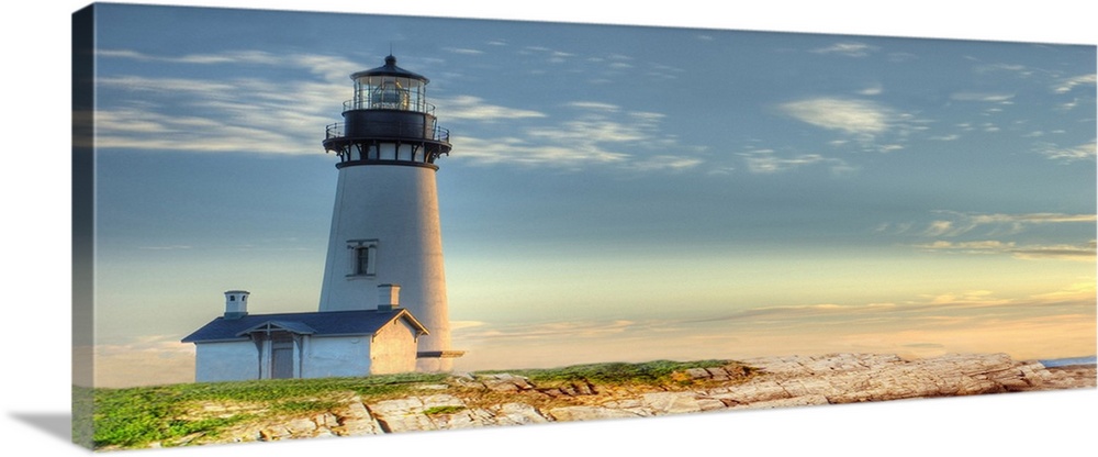 Photograph of a lighthouse against a blue sky.