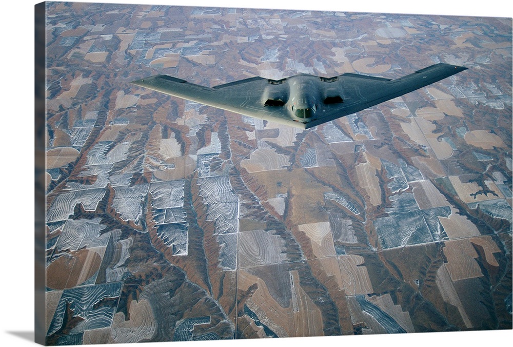A B-2 Stealth bomber over the patterned terrain of southwestern Nebraska.