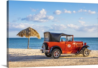 A Classic Car On A Beach In Playa Ancoa, In Trinidad, Sancti Spiritus, Cuba