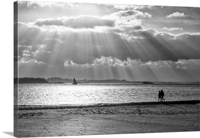 A Couple Walk Along The Plage Du Mole At Sunset, St. Malo, Brittany, France