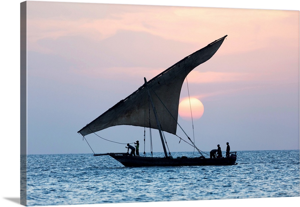 A Dhow Sails In Front Of The Setting Sun, Stone Tpwn, Zanzibar, Tanzania
