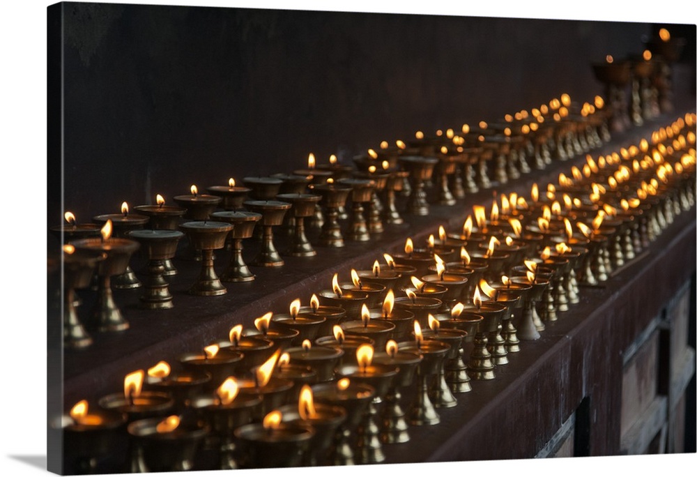 A long line of butter lamps burning at the Changangkha Temple, a fine 15th century temple, on the outskirts of Thimphu.