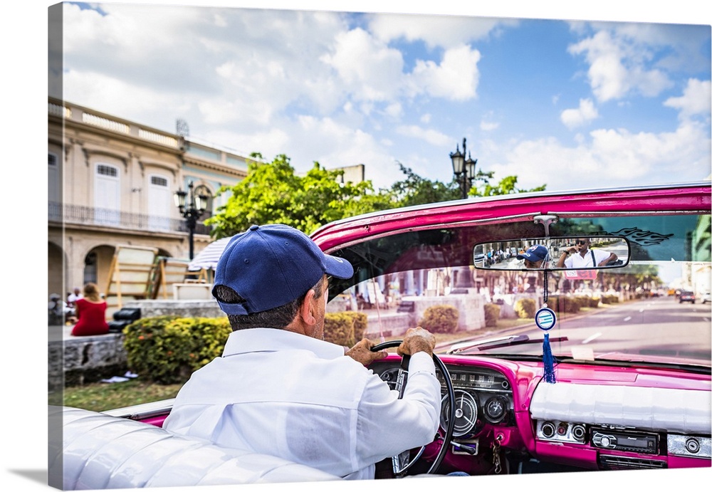 A man driving a classic car in Centro Habana District, Havana, Cuba