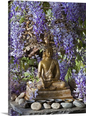 A small Buddha shrine surrounded by wisteria in the Hotel Gangtey Palace