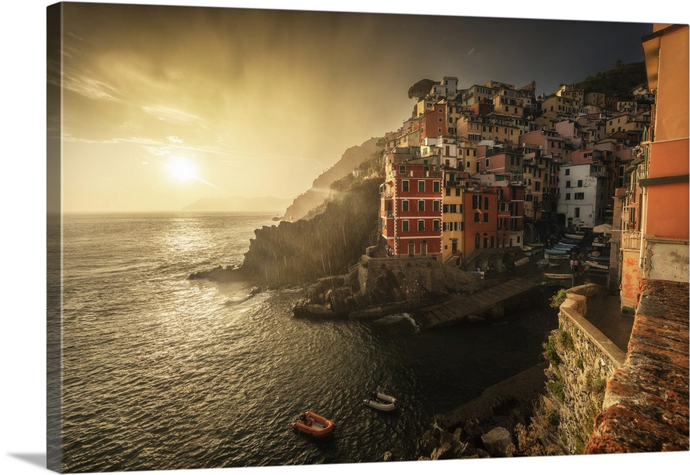A stormy summer sunset in the town of Riomaggiore, one of the Cinque Terre. Cinque Terre, Italy