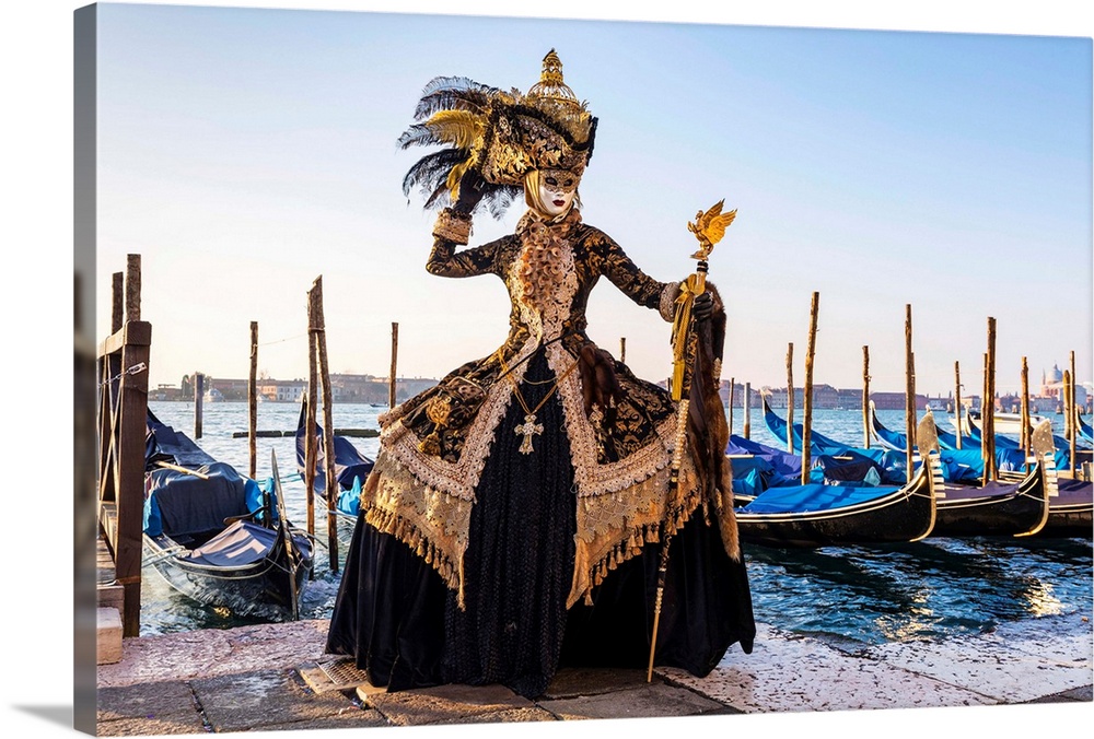 A Woman In A Magnificent Costume Poses In Front Of Gondolas During The Venice Carnival, Venice Lagoon, St. Mark's Square, ...