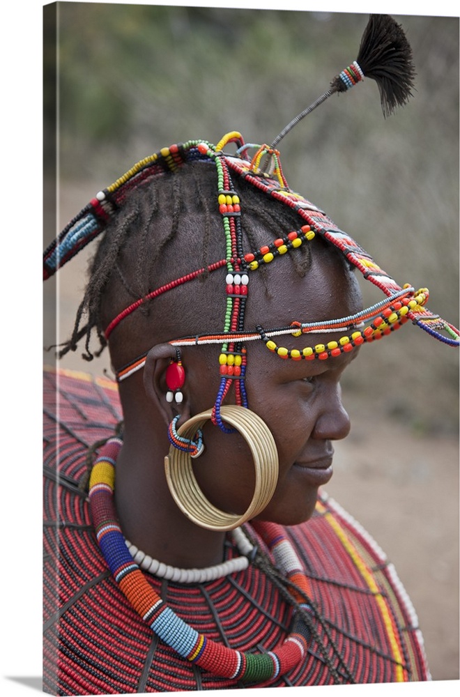 A young married Pokot woman wearing the traditional beaded ornaments of her tribe which denote her married status. The Pok...