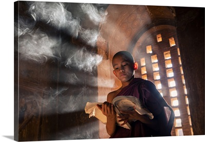 A Young Monk Reading By A Window Inside A Temple, UNESCO, Bagan, Myanmar