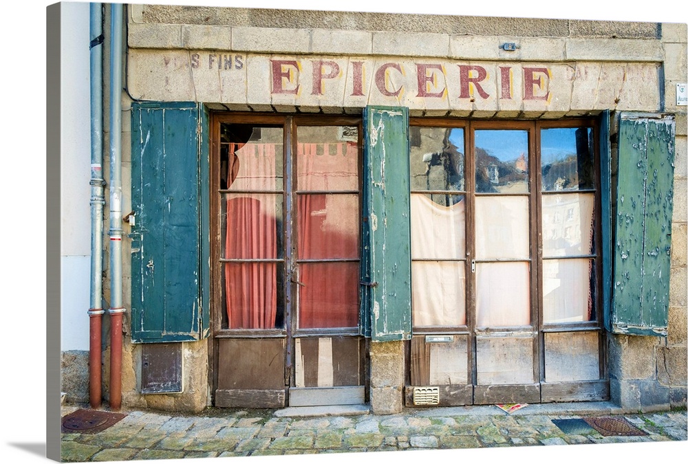 Abandoned storefront vintage painted sign of old Epicerie market store, Aubusson, La Creuse Department, Limousin, France.