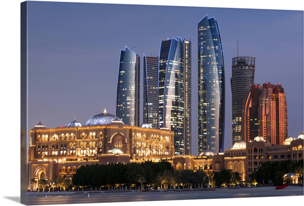 UAE, Abu Dhabi, Etihad Towers and Emirates Palace Hotel, dusk.