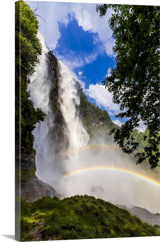 Acquafraggia Waterfall in spring with a rainbow. Valchiavenna, Valtellina, Lombardy, Italy, Europe.