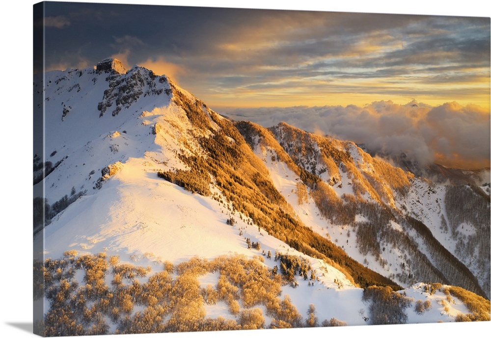 aerial sunset in winter time taken by drone of Gendarme Mountain, Tuscan-Emilian Apennine National Park, Sassalbo, municip...